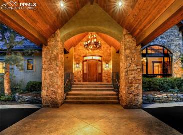 Magnificent elk antler chandelier and grand porte-cochere confirm that you have arrived