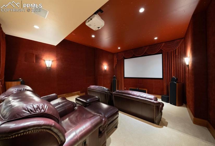 Cozy movie theatre complete with all equipment and ambient lighting