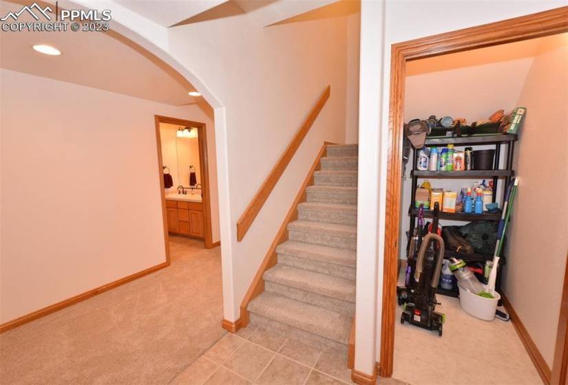 Bottom of stairs, large storage closet