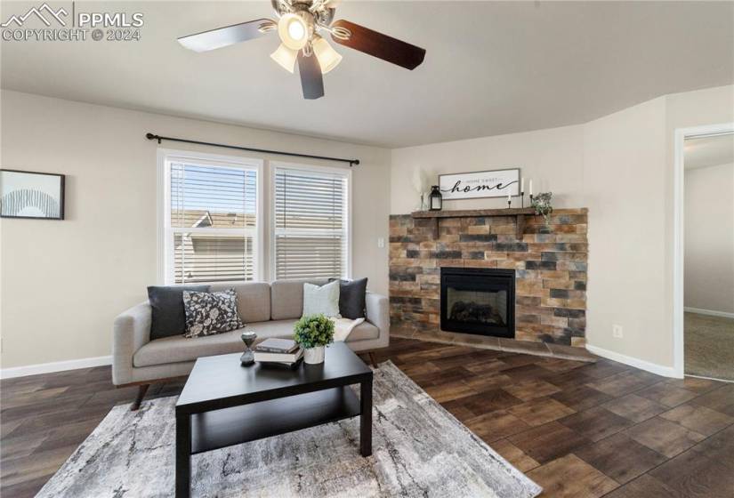 The living room features a gas fireplace and vaulted ceilings.