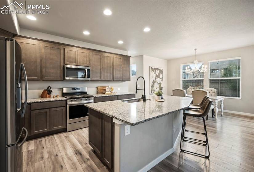 Beautiful kitchen with granite counters, huge island and upgraded appliances!