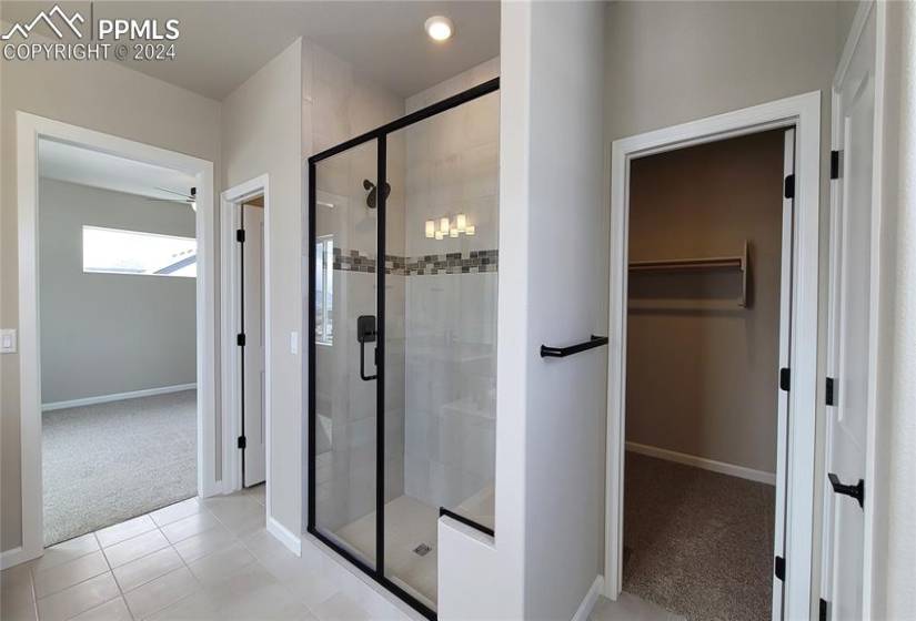 Primary Bathroom with linen closet, conveniently attached to the large walk-in closet!