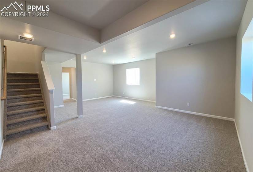 Finished lower-level with 9' ceilings, enjoys a spacious family room and game area that is prepped for a future wet bar!