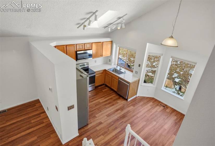 Vaulted ceilings and sky lights make for a bright, open floor plan