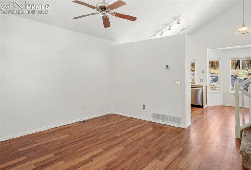 Wood laminate throughout main floor makes cleaning easy and adds warmth to your decor. Brand new interior paint and newer whole-house central A/C!