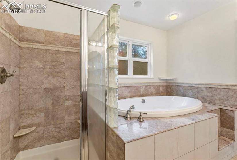 Free standing shower & oval soaking tub in MBR bath