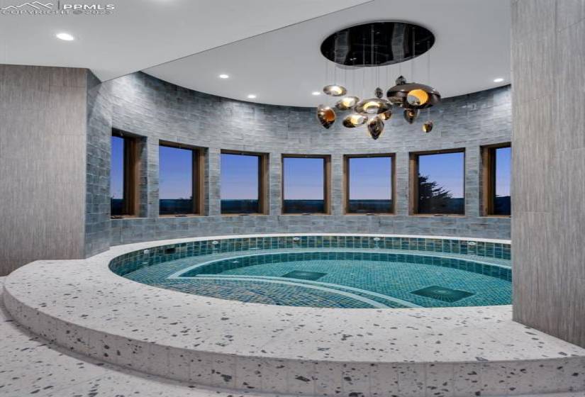 Indoor Hot Tub. This lower level pool room has a full bar, steam room, sauna and bath