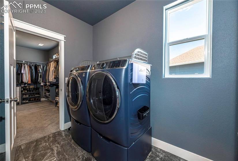 Laundry room perfectly located near second level bedrooms, and adjoins the master closet.