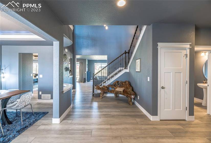 Welcoming entry way to and wide-open floor plan. LVT throughout main and basement.
