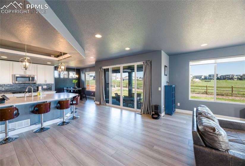 Open design. Abundant natural light. Oversized double sliding doors leading to the extended covered patio.
