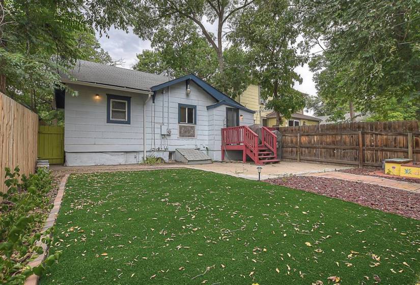 Backyard with xeriscaping and artificial turf