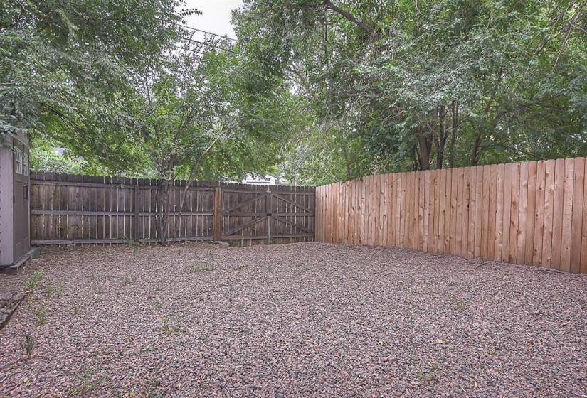 Back yard with gate to access for off-street parking