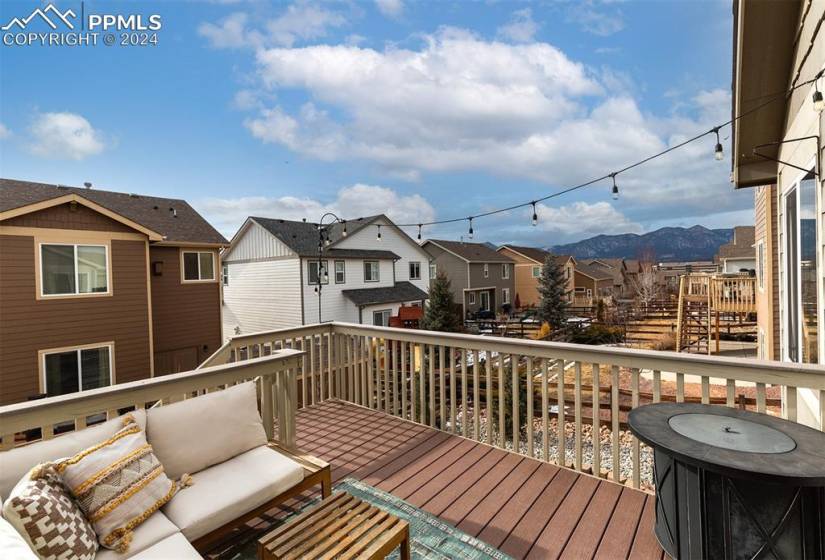 Composite deck overlooking the mountains and the fully fenced, thoughtfully Xeriscaped backyard w/ 5 new trees.