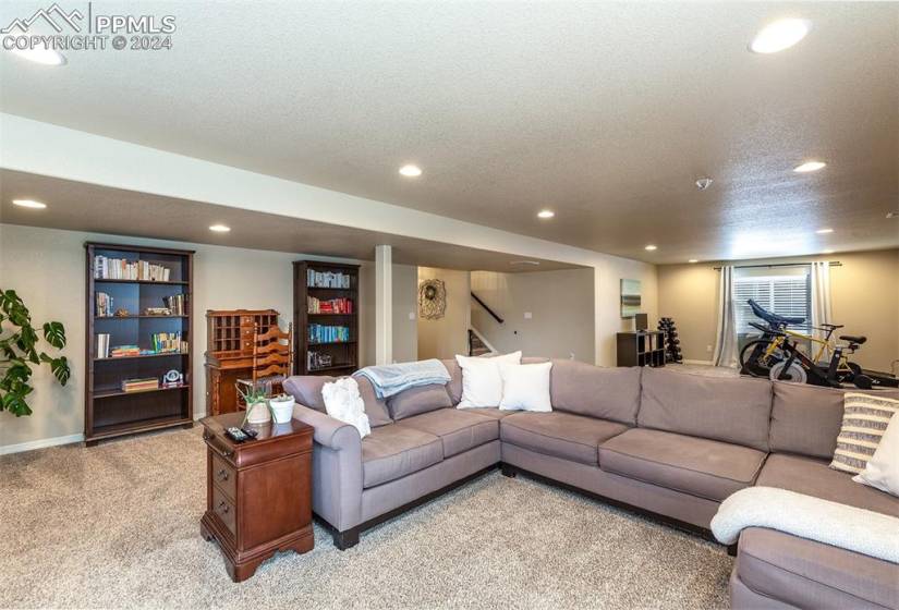 Spacious & bright garden level basement w/ large family rec room & a nook perfect for a home office, workout or play area.
