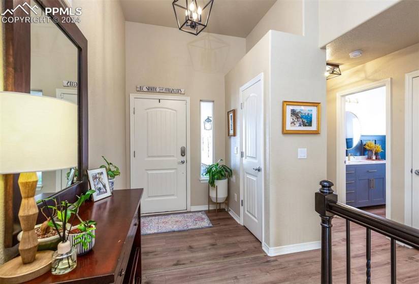 Spacious covered entry with coat closet and updated Luxury Vinyl Plank flooring
