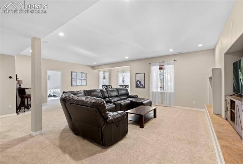 Large family room in basement with fireplace