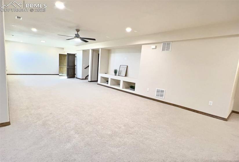 Finished basement includes theatre room, 2 bedrooms, and a full bathroom along with a large storage area.