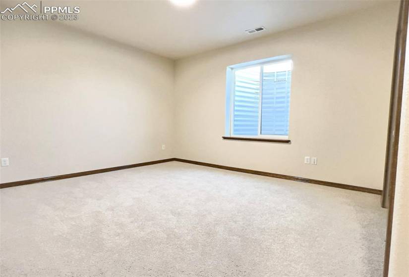 There are two oversized bedrooms in the basement that share a bath as seen in the next pictures