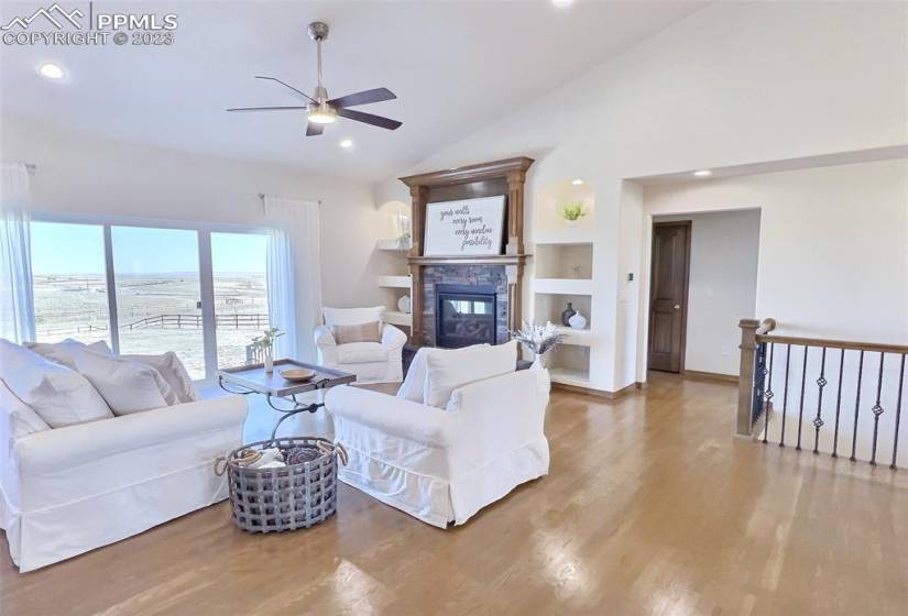 Open floor plan features real hardwood flooring and beautiful finishes.