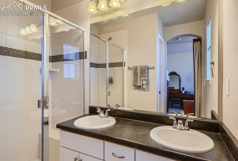 Main Bathroom boasts double sinks, a shower with Chrome bathroom fixtures.