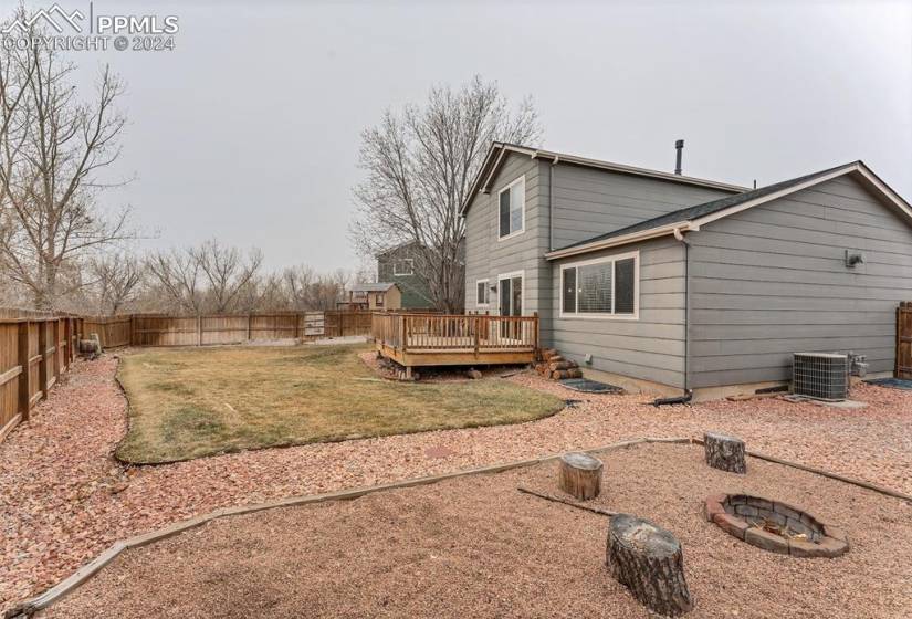 Oversized lot that comes with a playset, built-in firepit, shed and garden boxes!