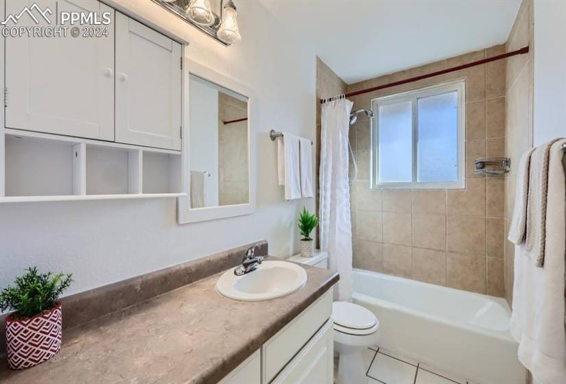 Full Bathroom with newer tile