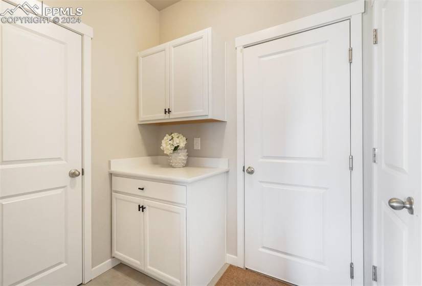 This butlers pantry area is just off the kitchen before entering into the garage. There are two more closets/ pantries!