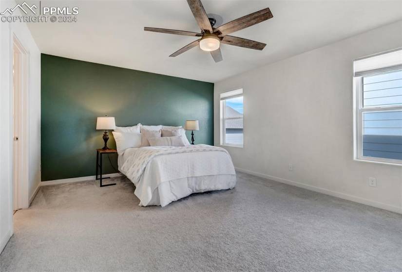 The Primary- Suite is also upstairs with an accent wall & upgraded ceiling fan.