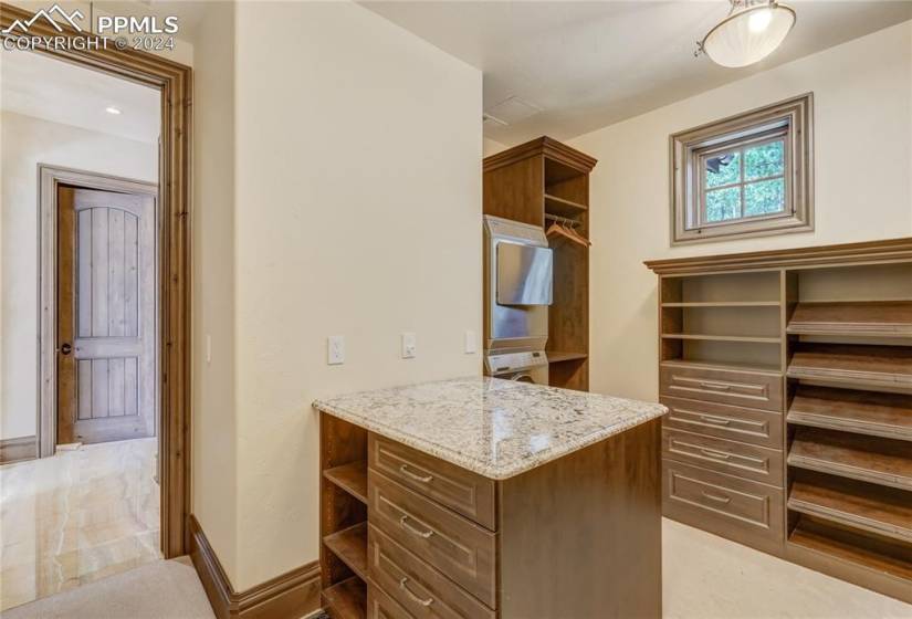 Primary offers 2 walk-in closets with built-in organizer and Miele washer/dryer and hidden safe