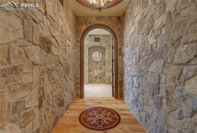 Dramatic stone and gorgeous wood details throughout
