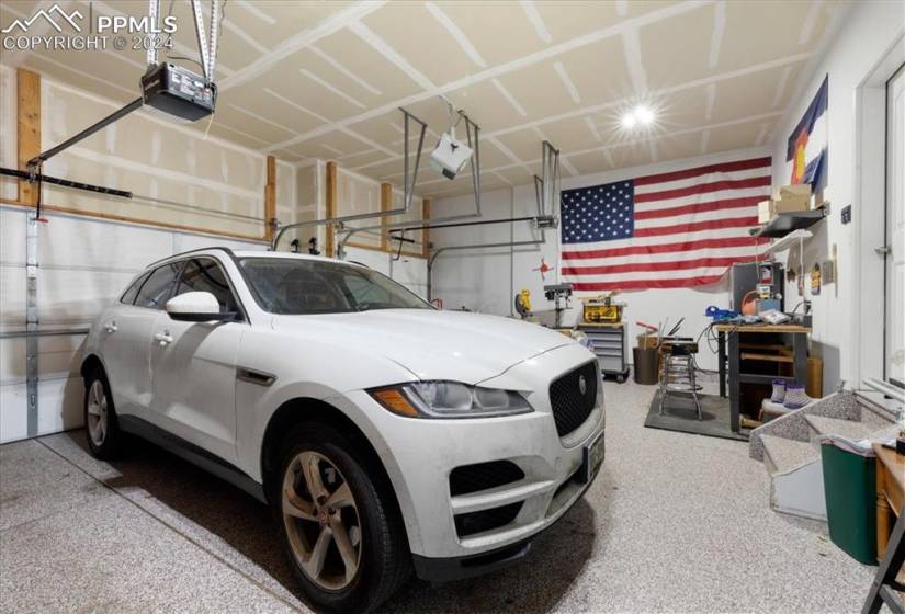 3-car attached garage with epoxy floor and door opener.