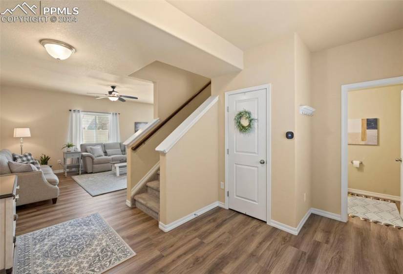 Entry with coat closet and half bath
