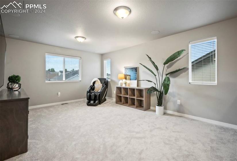 Loft upstairs is a second family room with peek-a-boo views!