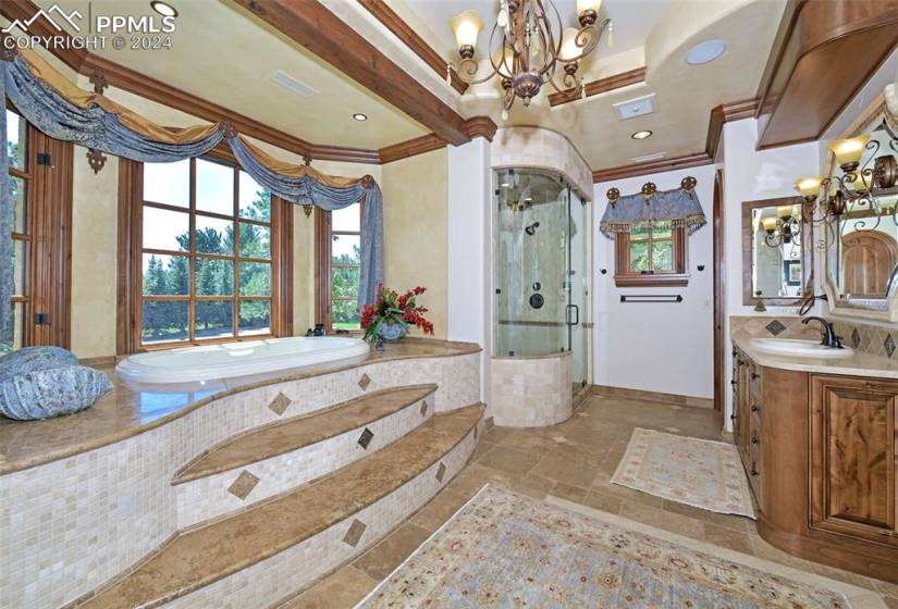 Bathroom featuring a chandelier, vanity, crown molding, tile flooring, and shower with separate bathtub