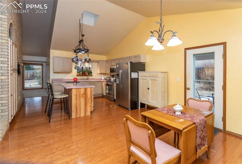 Kitchen featuring light hardwood / wood-style flooring, plenty of natural light, and stainless steel appliances.