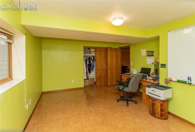 Home office featuring light parquet floors.