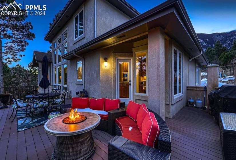 Trex deck with a mountain view and an outdoor living space with a fire pit