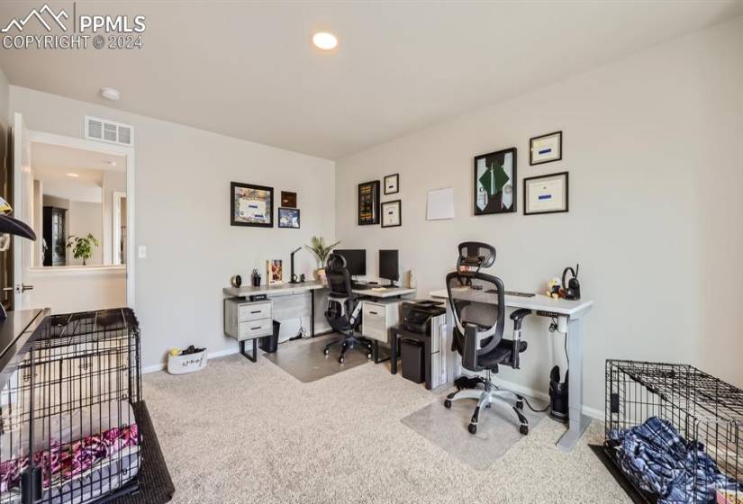 Home office featuring carpet floors