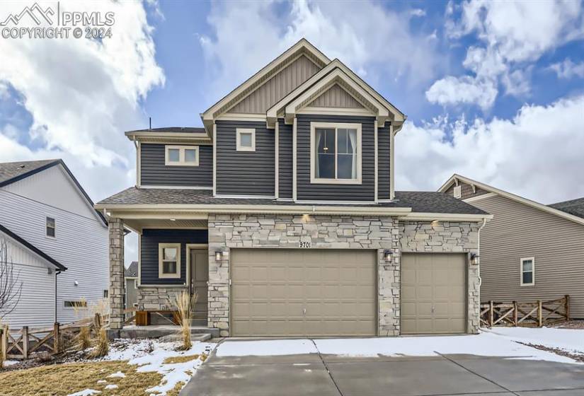 Craftsman inspired home with a garage and covered porch