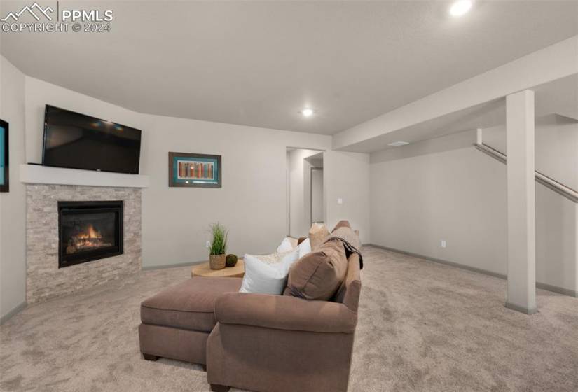 Basement rec room fireplace and included TV.