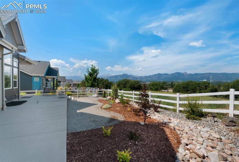 View of yard with a mountain view and expanded patio