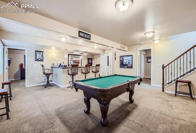 Basement family room featuring wet bar and pool table