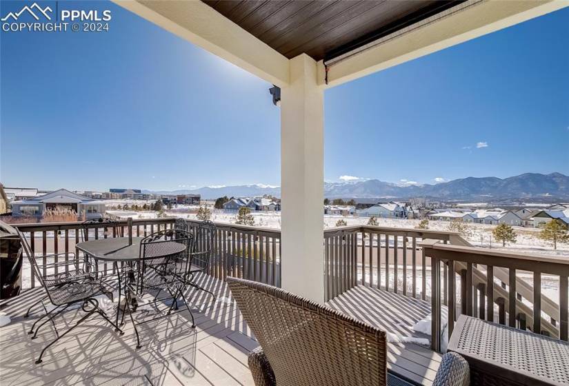 Partially covered deck with mountain view off Dining room