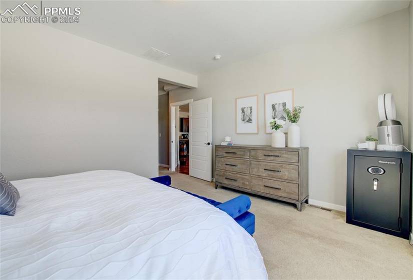 Master bedroom with on suite bath, walk in closet, and adjoining laundry