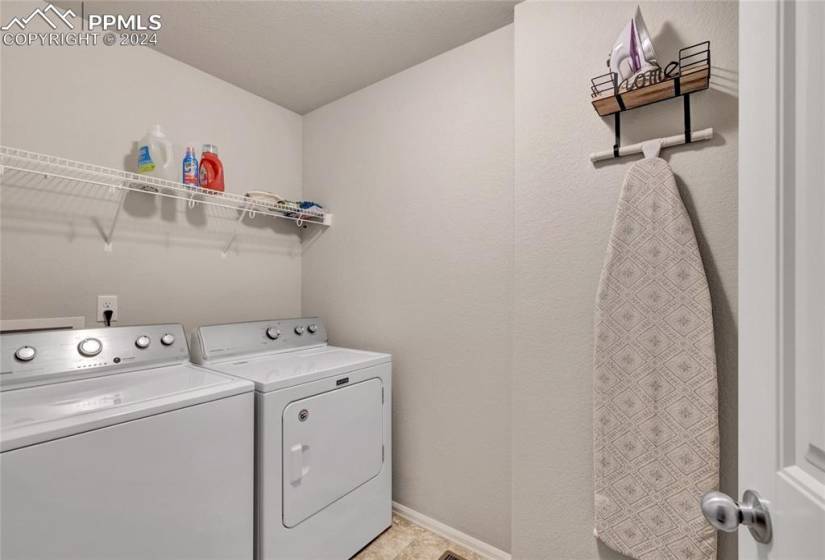 Laundry room with washer and dryer included