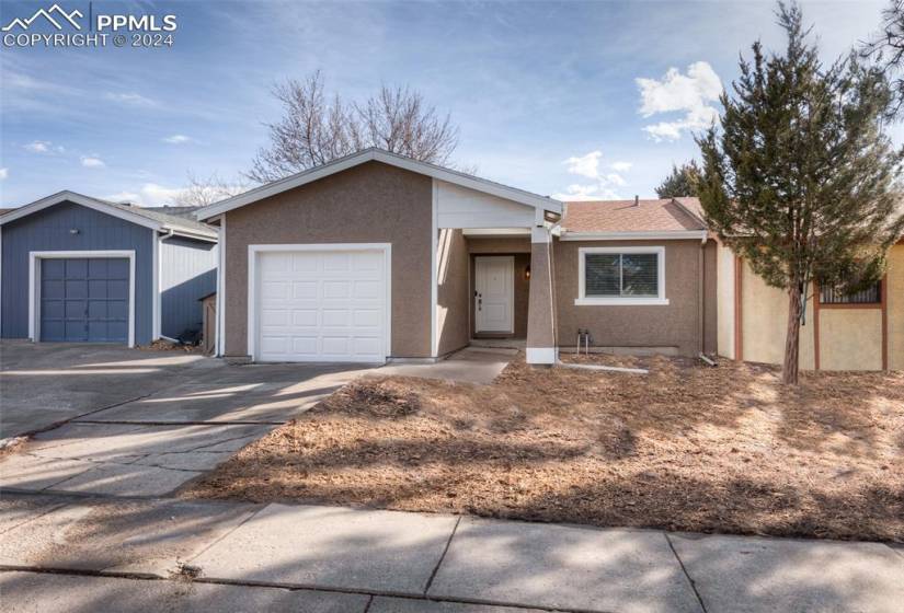 Ranch-style home featuring a garage