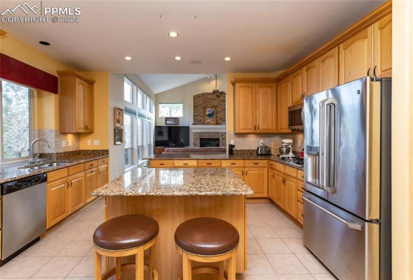 Kitchen featuring appliances with stainless steel finishes, plenty of natural light, and a kitchen island