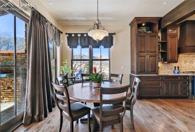 Dining space featuring a chandelier and light hardwood / wood-style flooring