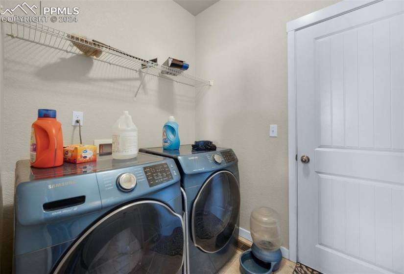 Washroom featuring washing machine and clothes dryer and washer hookup