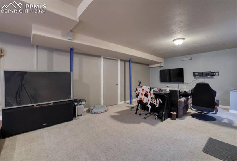 Spacious Basement Family Rec Room currently w/ TV and game area.